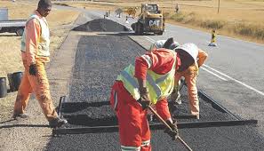 Road repair and resurfacing (Membaiki jalan rosak)
